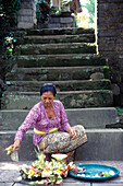 sacrifice from a balinese woman, ubud, bali, indonesia