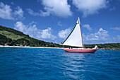 A red sailing boat, Tobago Cays, St. Vincent and The Grenadines, Carribean