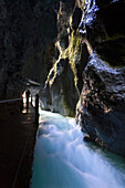 hiking in Partnachklamm gorge near Garmisch Partenkirchen, Upper Bavaria, Germany