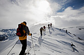 A group of ski tourists on a ski tour to the of Malka Todorka and Todorin Vrah in the Pirin Mountains, Bulgaria, Europe