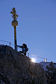 Man on the summit of the Zugspitze in the morning, Bavaria, Germany