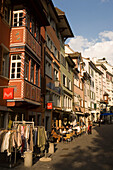People strolling over Augustinergasse with different stylish boutiques and pavement cafes, Zurich, Canton Zurich, Switzerland