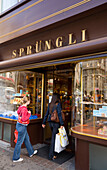 Two women entering the shop Sprüngli (famous chocolate confectionery), Bahnhof Strasse, Zurich, Canton Zurich, Switzerland