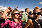 Portrait of a young man wearing big sunglasses at Street Parade (the most attended technoparade in Europe) near Quai Bridge, Zurich, Canton Zurich, Switzerland