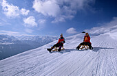 Two persons sledging on toboggan-run Bramberg, Wildkogel, Neukirchen, Salzburg, Austria