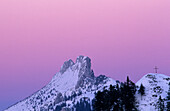 Summit of Kampenwand with cross in pink dawn, Chiemgau, Upper Bavaria, Bavaria, Germany