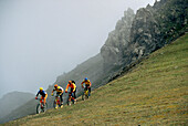 Four people on a mountainbike tour, Arosa, Grisons, Schwitzerland, Europe