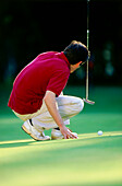 A golfer at Munich Golf Club, Strasslach, Munich, Bavaria, Germany, Europe