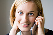 Young woman phoning with a mobile phone