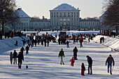 Ice stock sport at Nymphenburg Palace in winter, Munich, Bavaria, Germany