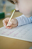 Concentrated boy writing