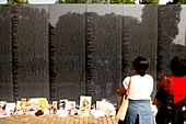 Two women in front of the Vietnam Veterans Memorial, Washington DC, United States, USA