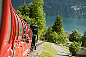 Brienz Rothorn Railway, Switzerland's oldest cogwheel railway leaving Brienz, Lake Brienz in the background, Bernese Oberland, Canton of Bern, Switzerland