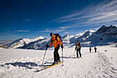 Group of people glacier hiking at Jungfraufirn glacier, Grindelwald, Bernese Oberland (highlands), Canton of Bern, Switzerland
