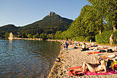 People relaxing at beach, Lake Fuschl, Fuschl am See, Salzkammergut, Salzburg, Austria