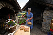 Mrs. Röck baking bread, Amoseralm (1198 m), Dorfgastein, Gastein Valley, Salzburg, Austria