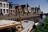 Houses along a canal, De Heerenwal, Sloten, Friesland, Netherlands, Europe