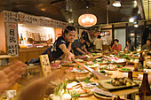 Waiters and guests in a traditional restaurant, Tokyo, Japan, Asia