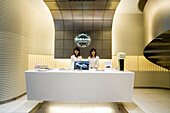 Two Women at the reception of the showroom, Nissan, Tokyo, Japan