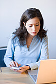 Young woman using laptop