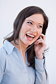 Young woman listening to music about earphones