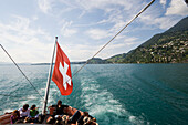 Paddle wheel steamer leaving Weggis, passengers sitting on deck, Weggis, Canton of Lucerne, Switzerland