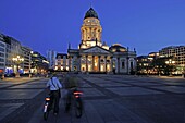 Couple with bicycles on Gerndarmenmarkt, Berlin