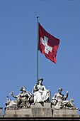 Switzerland, ,Zürich, main station, sculptures on roof top with swiss flag