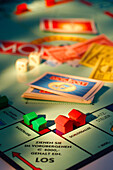 Toy houses on Monopoly board game