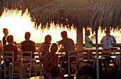 People at a Beach bar at sunset, Tel Aviv, Israel