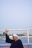 A man on a boat on the Nile, Luxor, Egypt