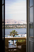 View through the balcony window towards the Nil, Luxor, Egypt