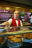waiter in Cafe, red waistcoat, Valencia, Spanien