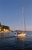 People in a sailing boat near the harbour, Piran, Slovenia
