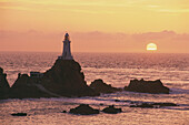 Corbiere Lighthouse at sunset, Jersey, Channel Islands, Great Britain