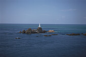 View of Corbiere Lighthouse on rocks, Jersey, Channel Islands, Great Britain