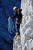 Man about to abseil, abseiling, Climbing rope, Alpine Climbing, Sport, Mountain, Wetterstein, Bavarian Alps, Bavaria, Germany