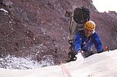 Ice climber climbing south wall of mount, Cerro Marmolejo 6085 m, Chile