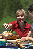 Two women having lunch outside, picnic, Muehlviertel, Upper Austria, Austria