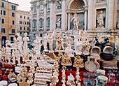 Trevi fountain, Fontana di trevi, souvenirs in the foreground, Rome, Italy