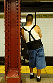 Man waiting for the train, New York City Subway, New York City, New York, USA