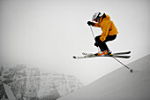 Skier skiing down run on Castle Mountain, castle mountain ski resort, South Alberta, Canada