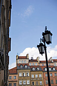 Street light in front of historical houses of the Old Town, Warsaw. Poland