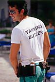 Tanning Butler at Hotel Ritz Carlton, South Beach, Miami, Florida, USA