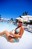 Girl with cocktail at Swimming Pool, South Beach, Miami, Florida, USA