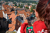 Woman in Traditional Costume Looking at Timberframe Houses in Schlitz, View from Schlitz Tower, Schlitz, Vogelsberg, Hesse, Germany