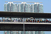 People walking over a bridge, Lantau, Hong Kong, China