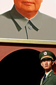 Soldier in front of Mao portrait, Beijing, China