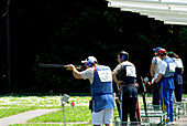 Five people standing at the firing range, Trap worldcup, Suhl, Thuringia, Germany