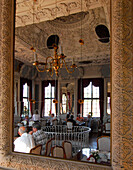 Reflection of a cafe in Hessensaal of castle Elisabethenburg, Meiningen, Thuringia, Germany